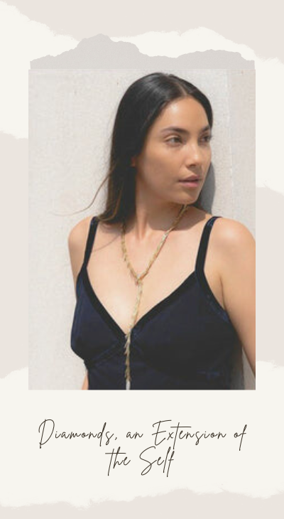 beautiful woman wearing a white gold diamond necklace by hueb